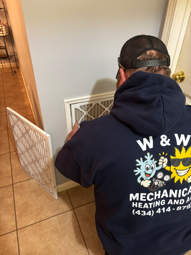 w and w mechanical heating and air technician working